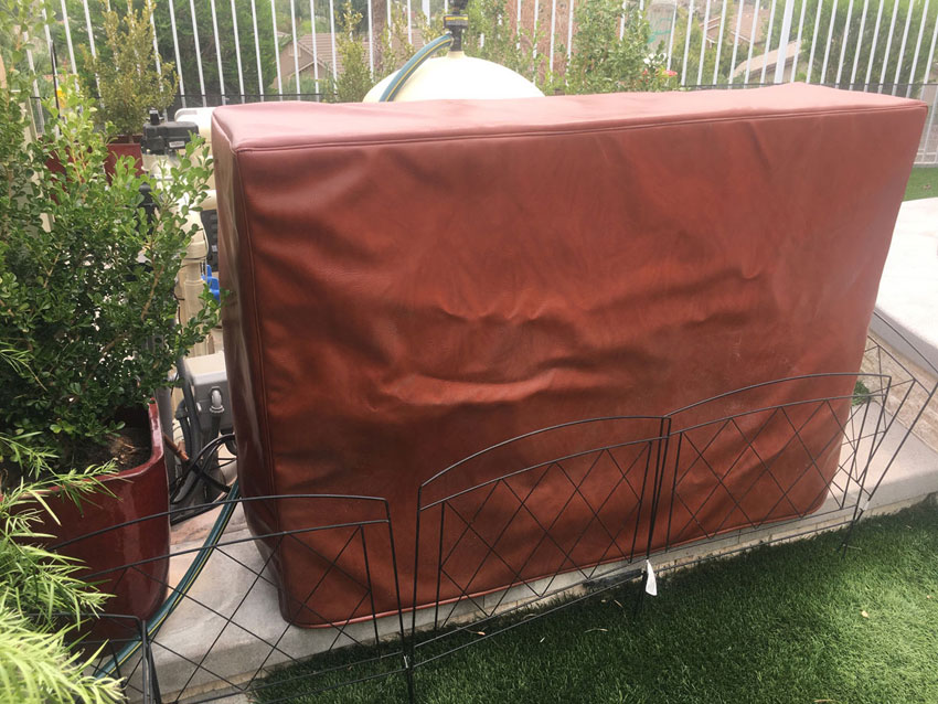 Custom cover for Phoenix outdoor TV lift in composite outdoor decking