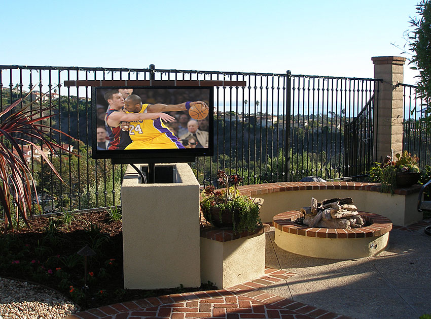 Sunbrite Outdoor TV in custom stucco TV lift with swivel