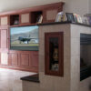 Traditional built-in wall unit, fireplace cabinet, and refrigerator cabinet.