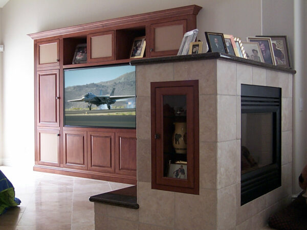 Traditional built-in wall unit, fireplace cabinet, and refrigerator cabinet.
