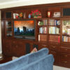 Built-in Entertainment Wall Unit in Cherry Finish with Bookcases and Lighted Display Space