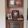 This alcove was opposite the built-in wall unit, we built a matching refrigerator cabinet and display cabinet.