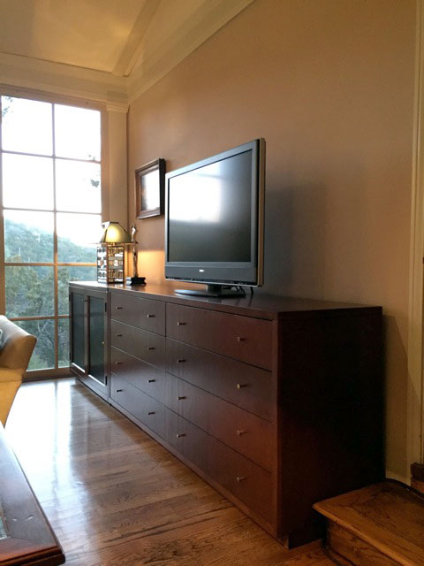 Angled view of media drawer and home theater cabinet