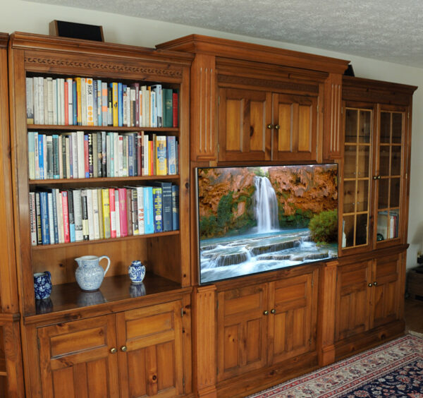 The new decorative columns provided the additional space needed to install a flat panel TV without interfering with the bookcase or display cabinet.