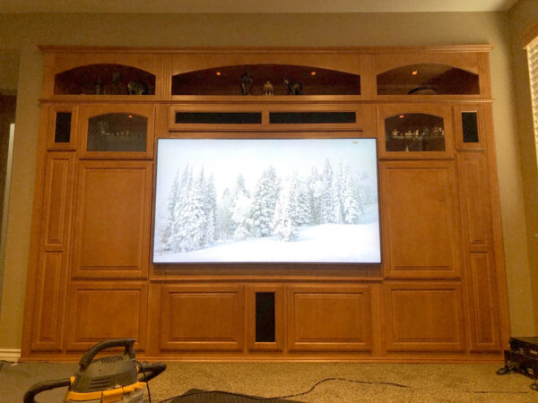 Large built-in home theater unit upgraded for big flat panel TV.