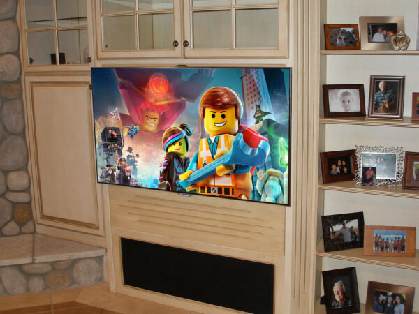 A close up view of the TV mounted on top of the face frame of the furniture, skinny TVs look great mounted this way.