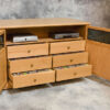 A unique element of this design with the inclusion of six high-capacity media storage drawers.