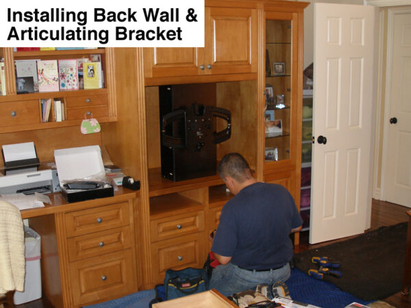 Here is a picture that shows us in the middle of the installation, you can see the TV back wall and the pull-out bracket before the TV was mounted.