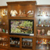 Three piece custom entertainment center and display cabinets.