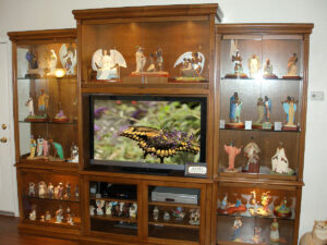 Three piece custom entertainment center and display cabinets.