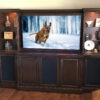 Traditional custom wall unit shown in an Espresso finish with lighted display space
