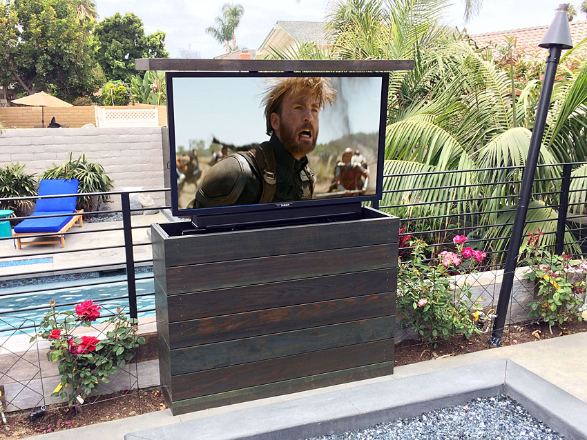 Customized Phoenix Outdoor TV Lift with Shiplap look. TV Raised.