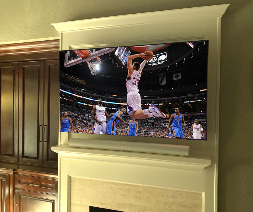 Samsung 4K Flat Panel TV in Bedroom Mounted above Fireplace