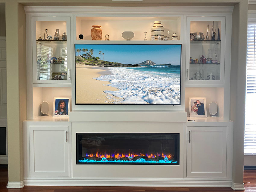 Built-in Entertainment Center in White with Electric Fireplace and Lighted Display Space