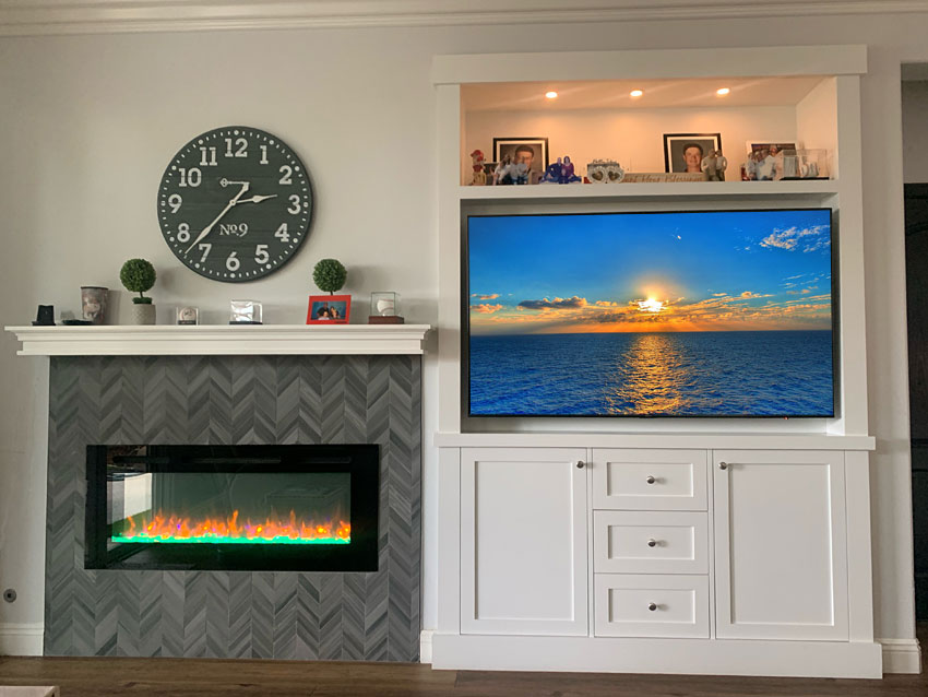 Custom Built-in Entertainment Center next to Electric Fireplace